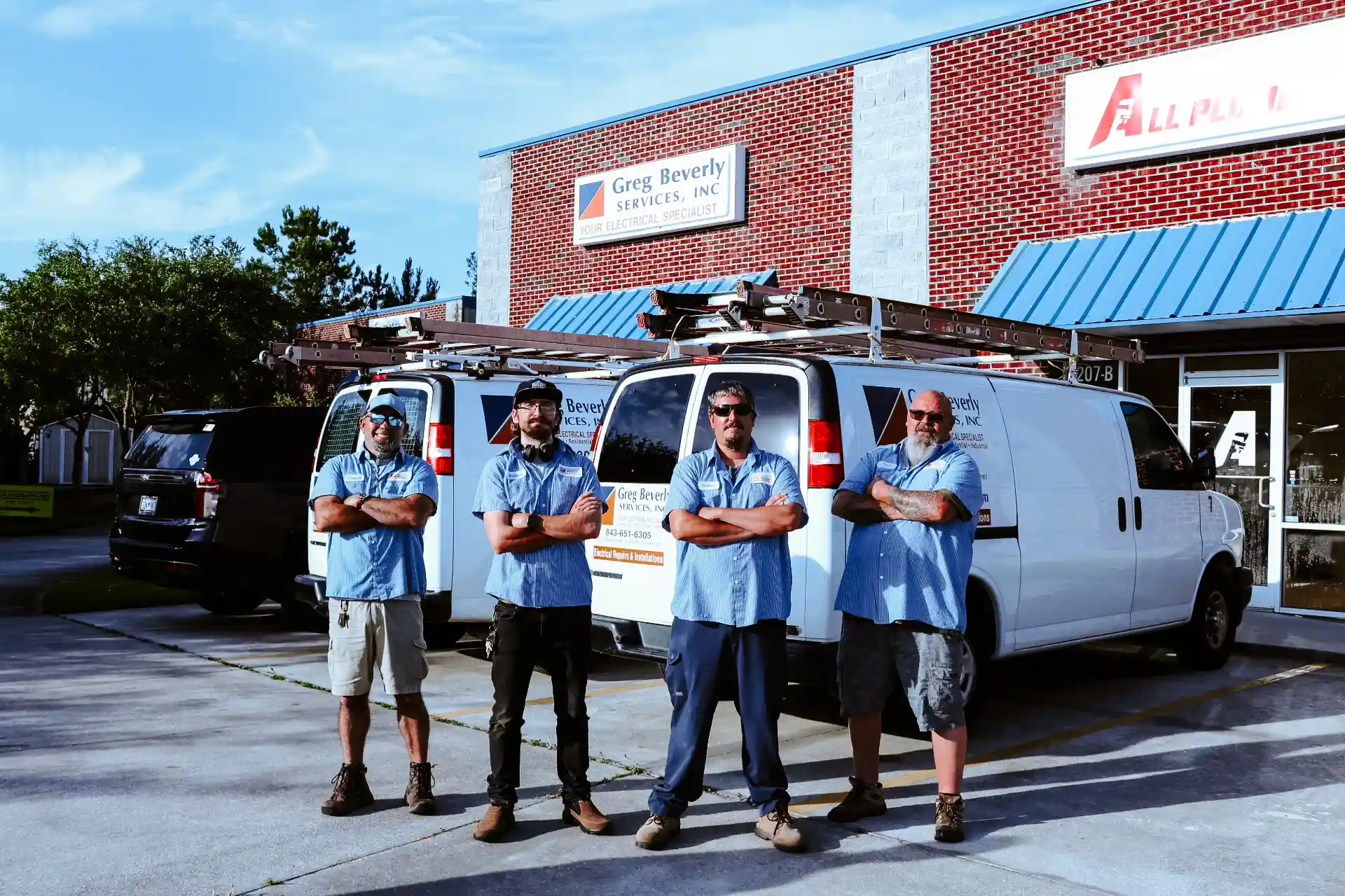 Greg Beverly Services team outside their business